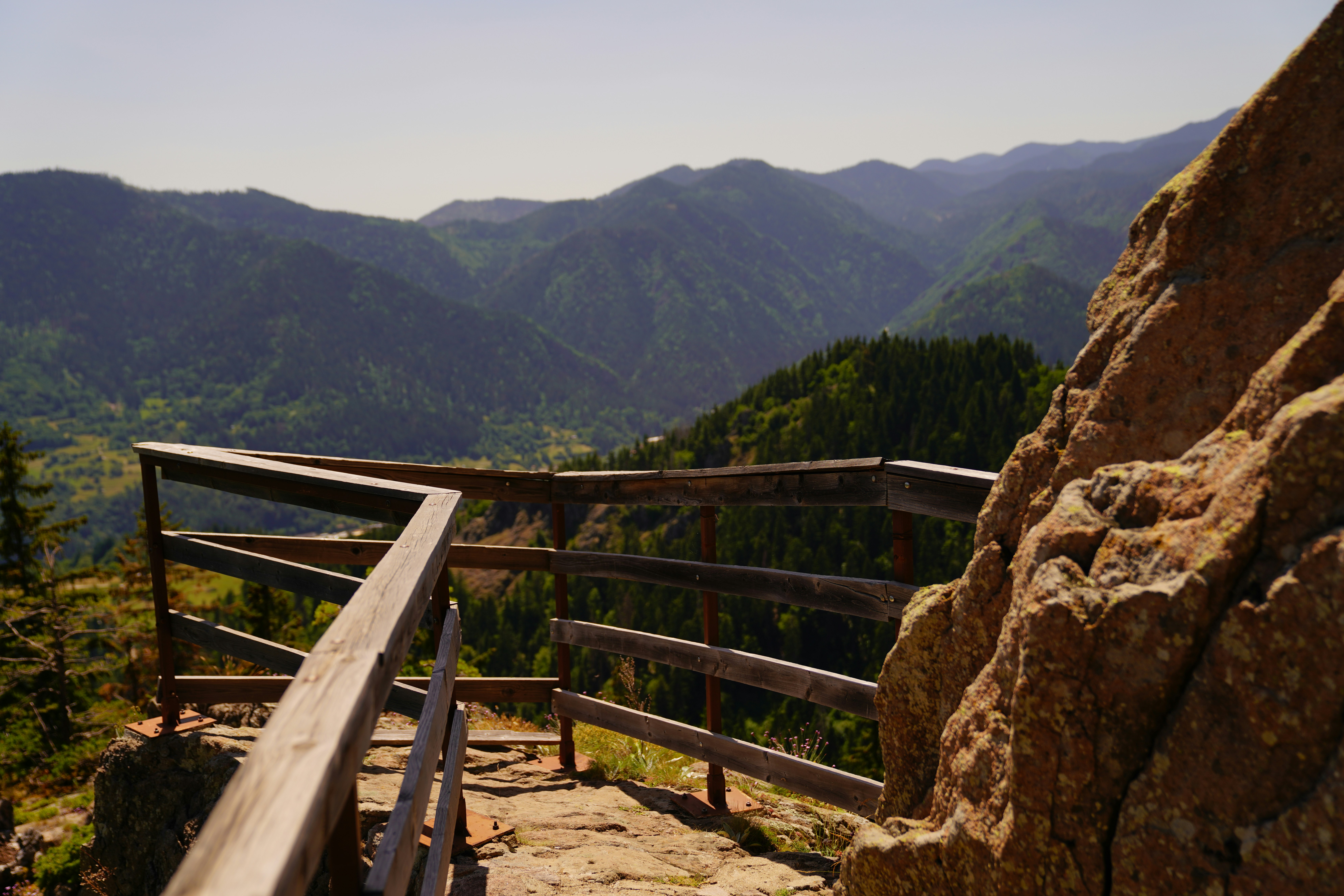 brown wooden fence on mountain during daytime