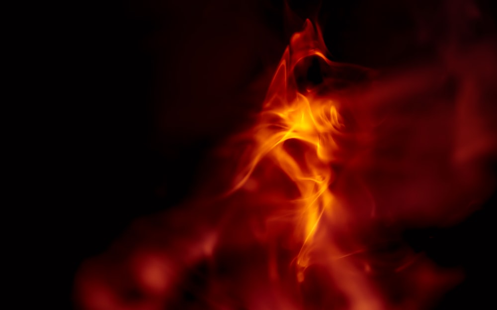 orange flame in dark room