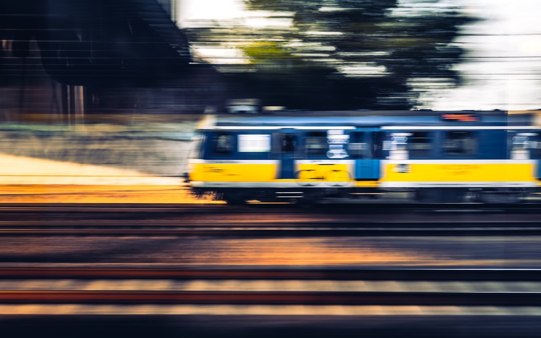 yellow and white train on track