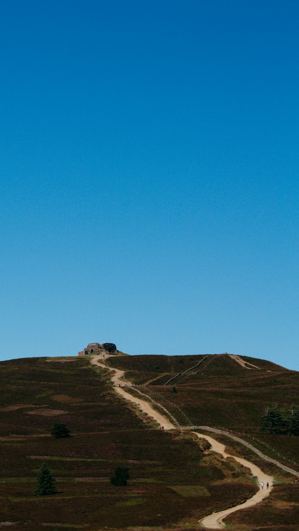 brown mountain under blue sky during daytime