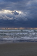 A dramatic battleship sailing on open sea under a stormy sky, symbolizing the slot game theme