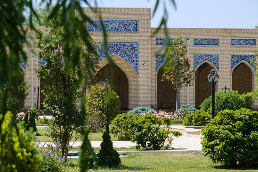 green trees near brown concrete building during daytime