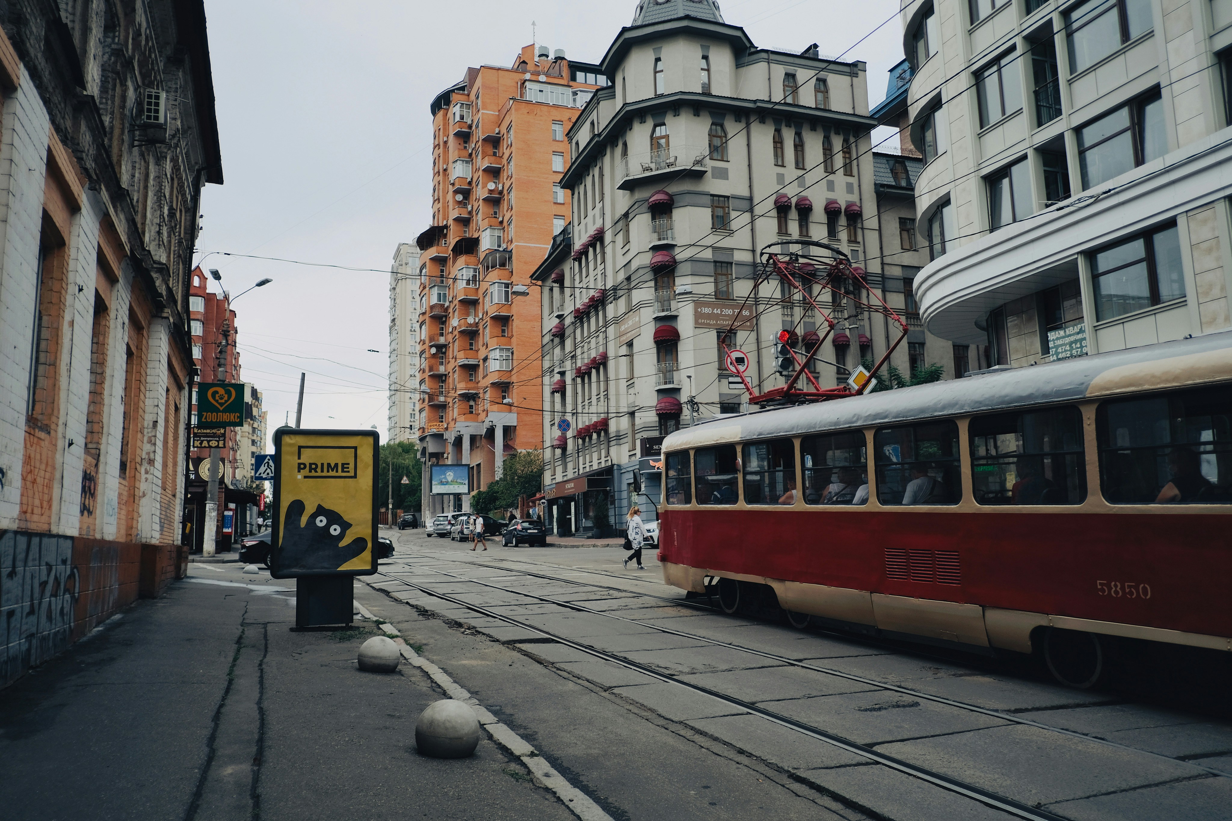red and white tram on road during daytime