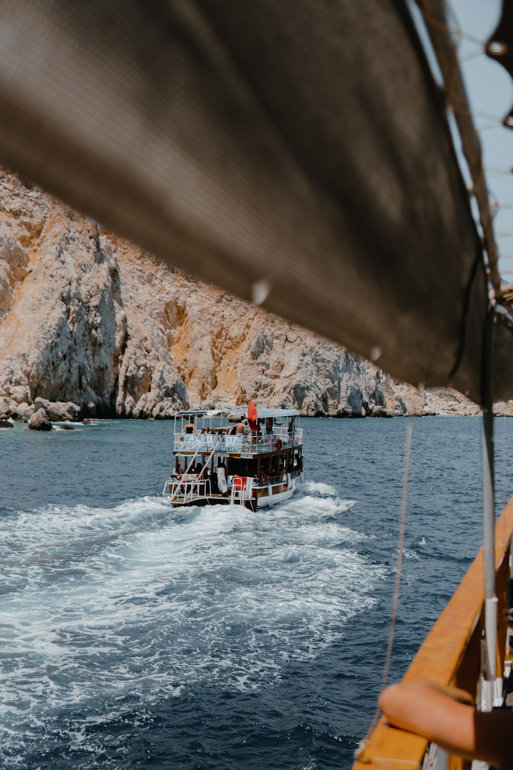 white and red boat on sea during daytime