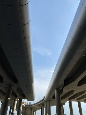 Elegant aerial view of a completed highway project showcasing smooth curves and clean design.