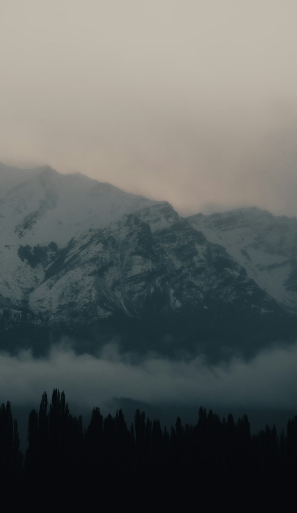 gray and black mountain under white sky during daytime