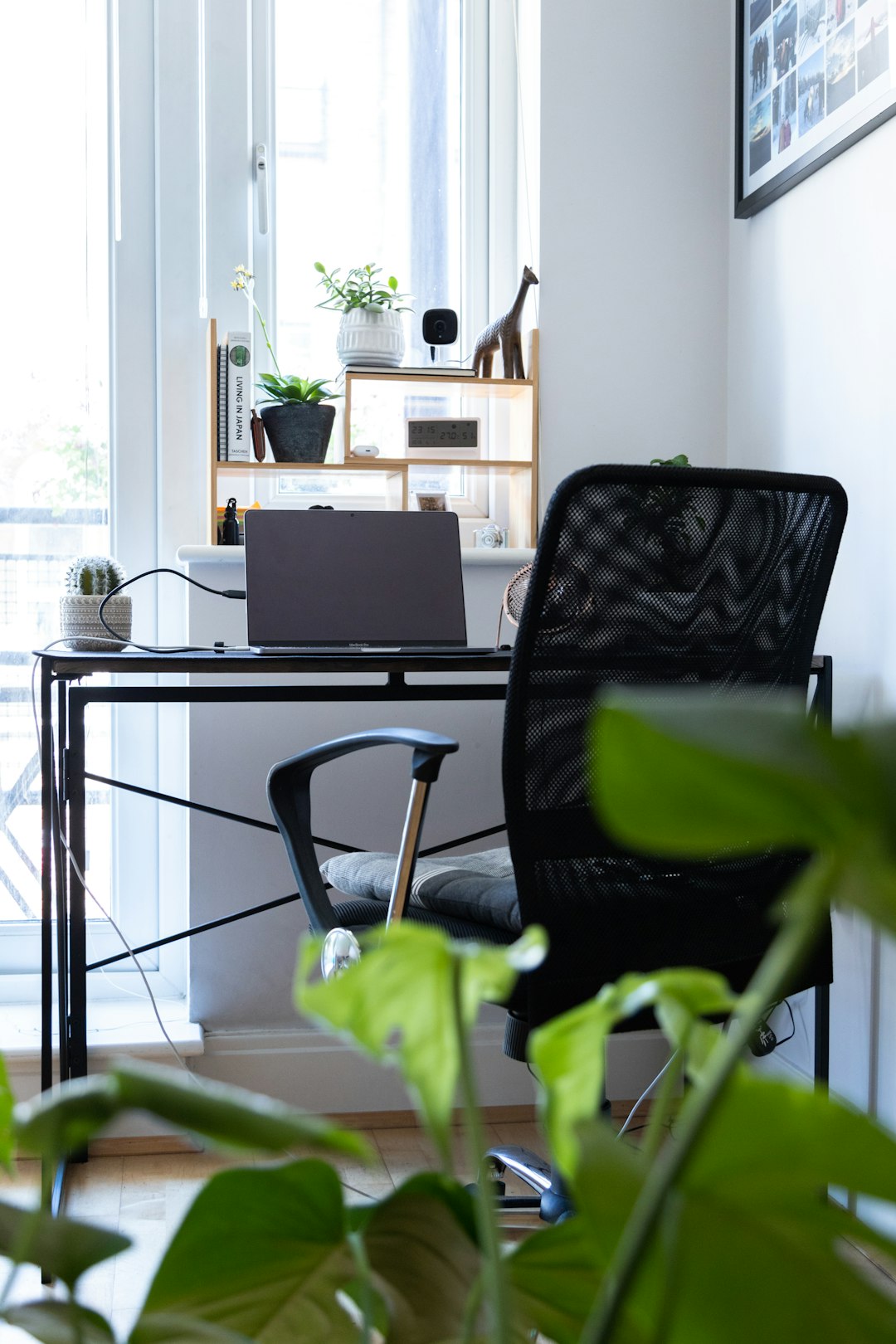 black and gray chair beside black laptop computer