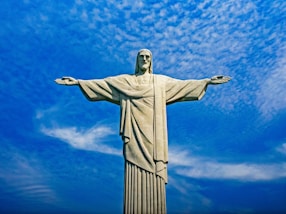 statue of liberty under blue sky during daytime