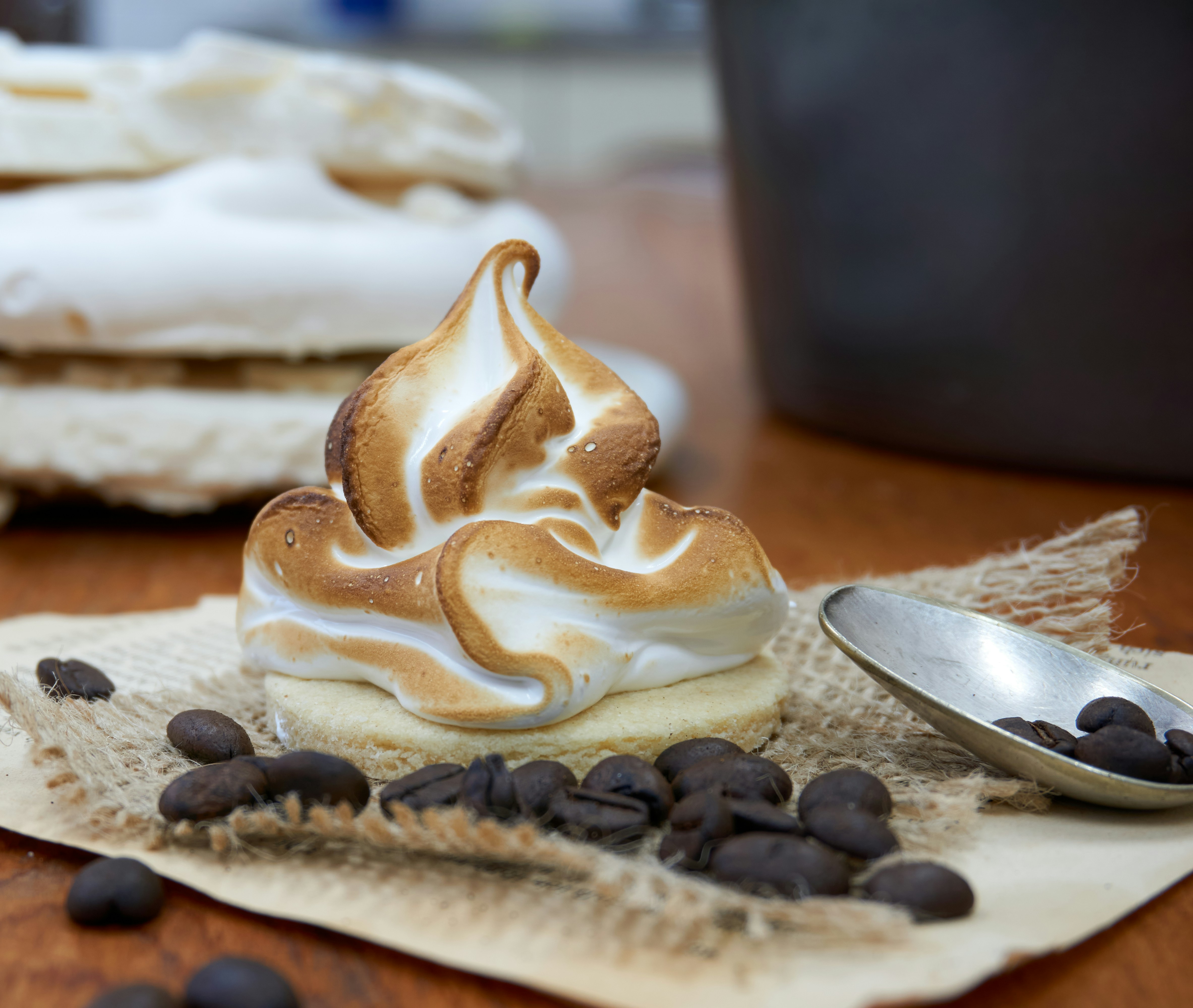 white icing covered cake on brown wooden table