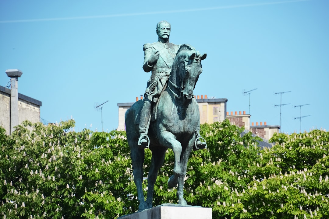 man riding horse statue during daytime