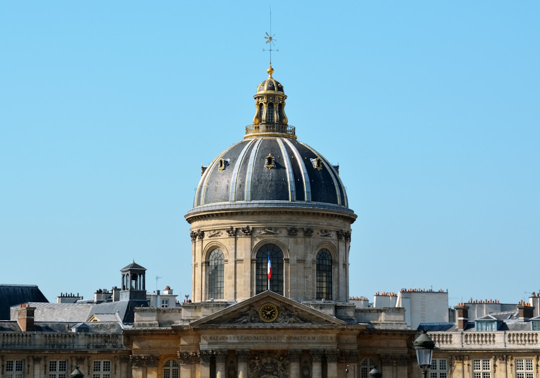 white and black dome building under blue sky during daytime