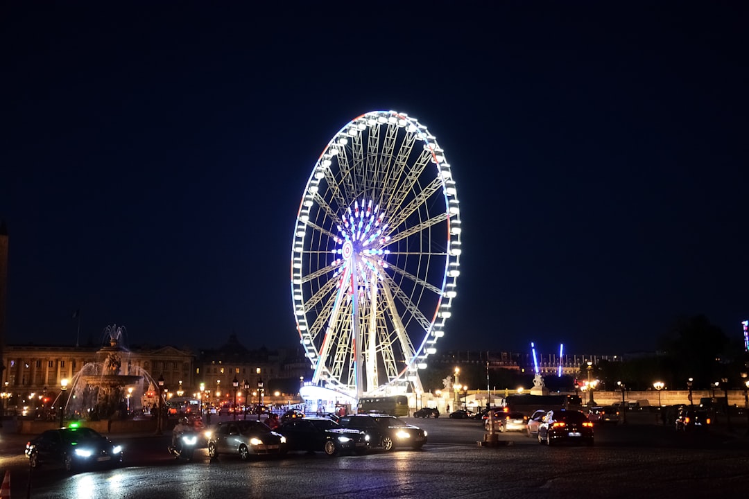 ferris wheel near ferris wheel during night time