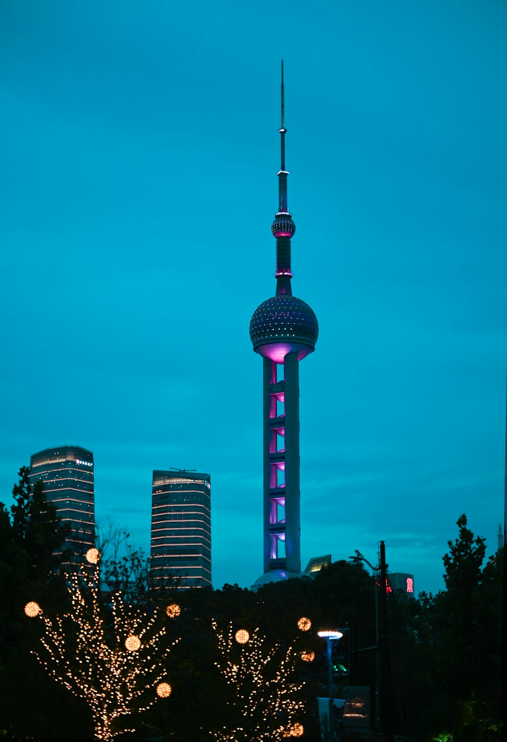 white and pink tower under blue sky