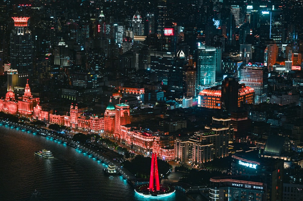 red tower in the city during night time