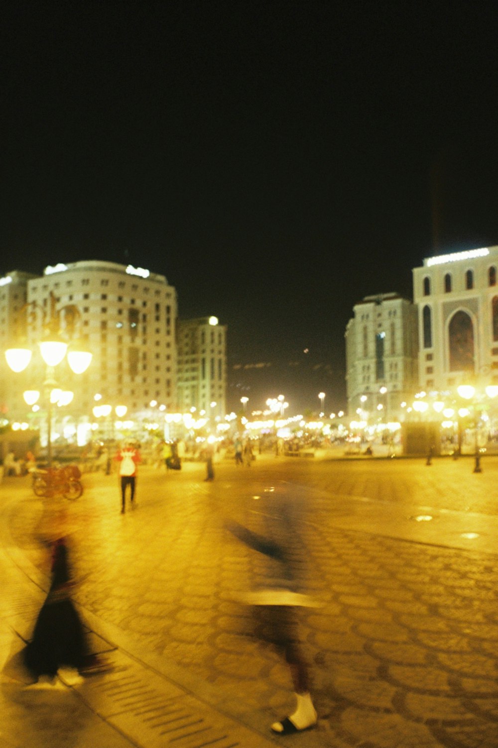 people walking on street during night time