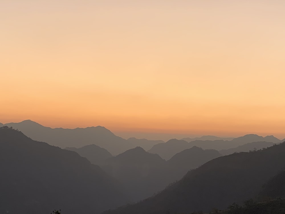 silhouette of mountains during sunset