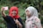 woman in white hijab and black hijab