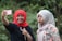 woman in white hijab and black hijab