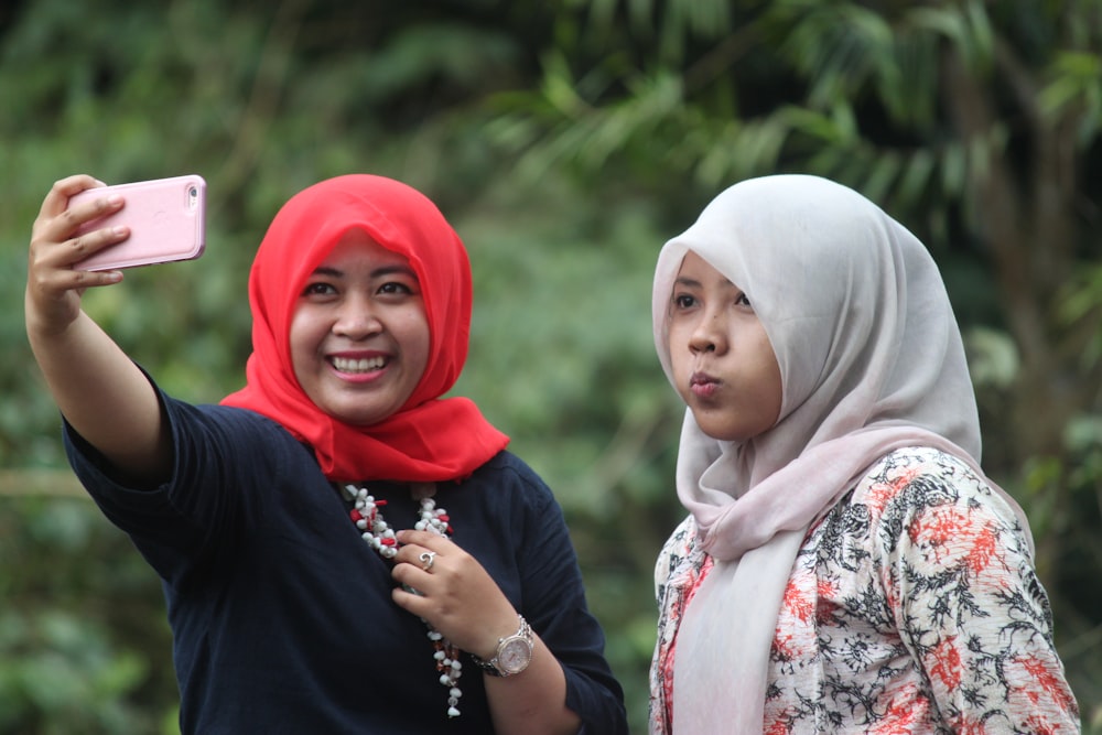 woman in white hijab and black hijab