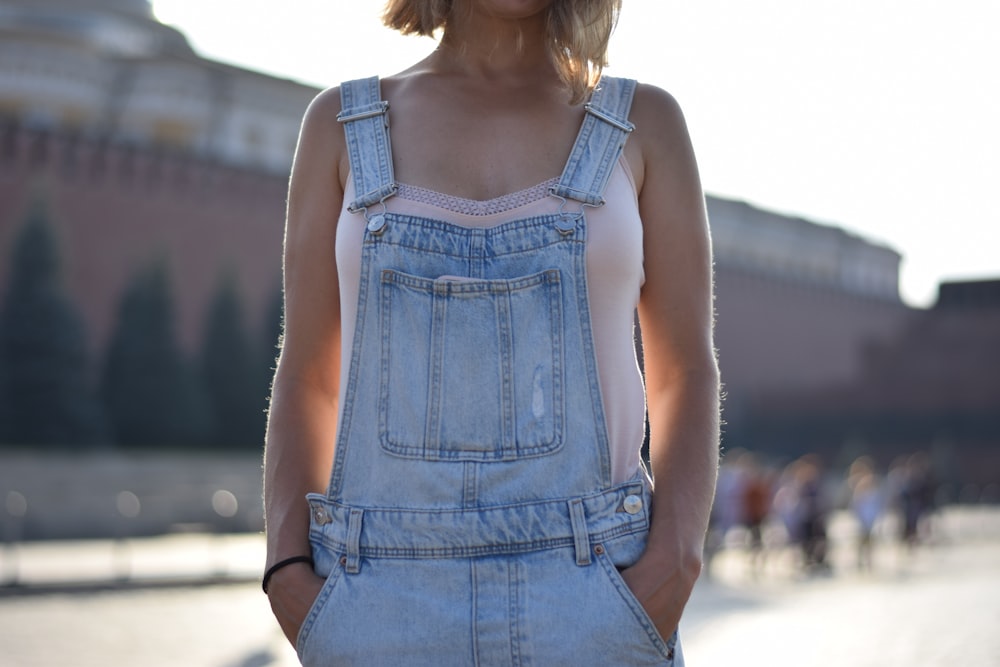 woman in blue denim sleeveless dress