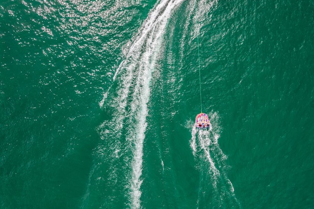 person in water surfing during daytime