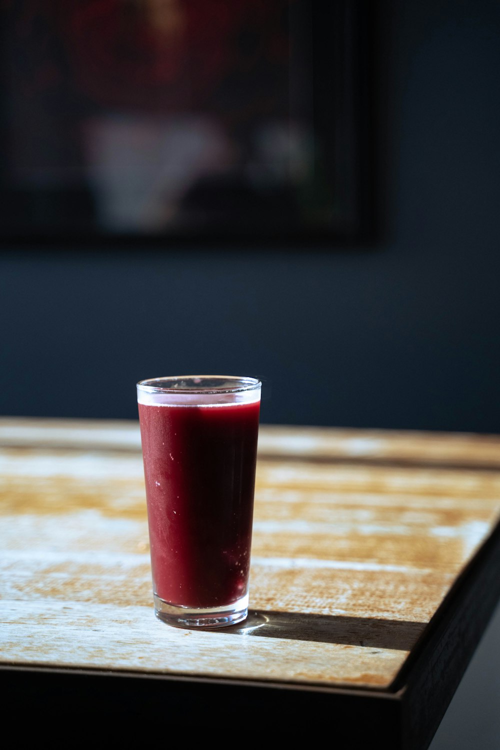 clear drinking glass with red liquid