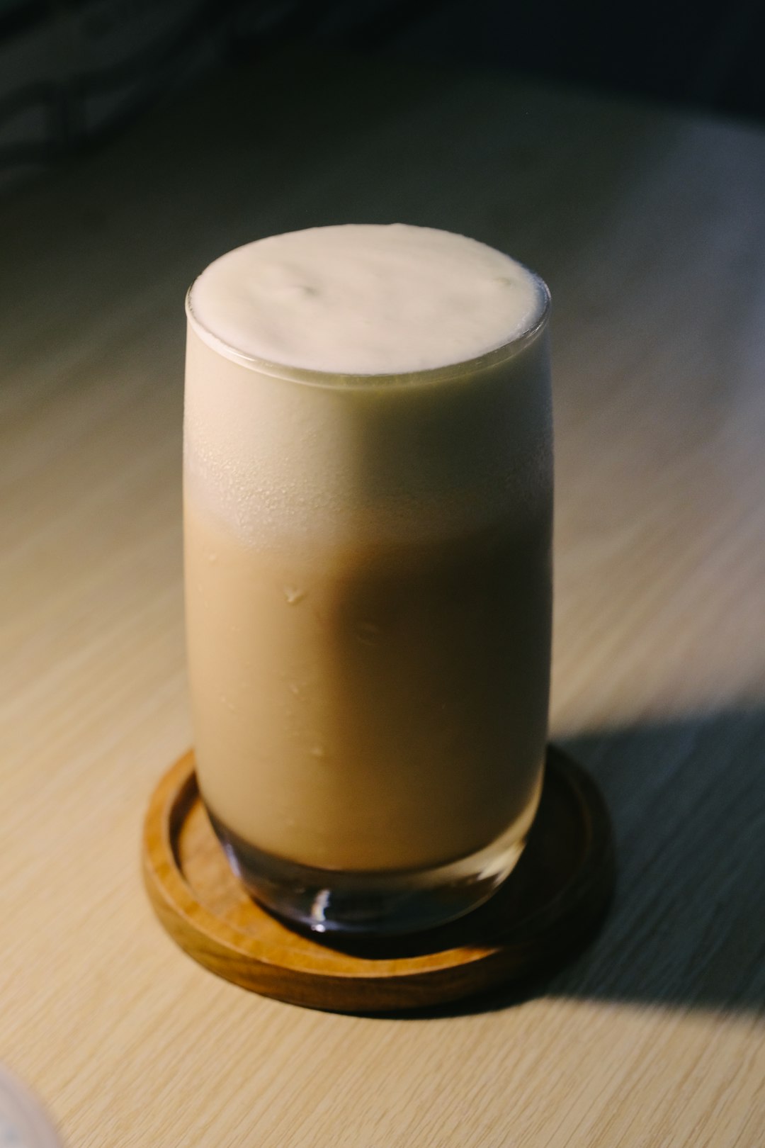 white pillar candle on brown wooden holder