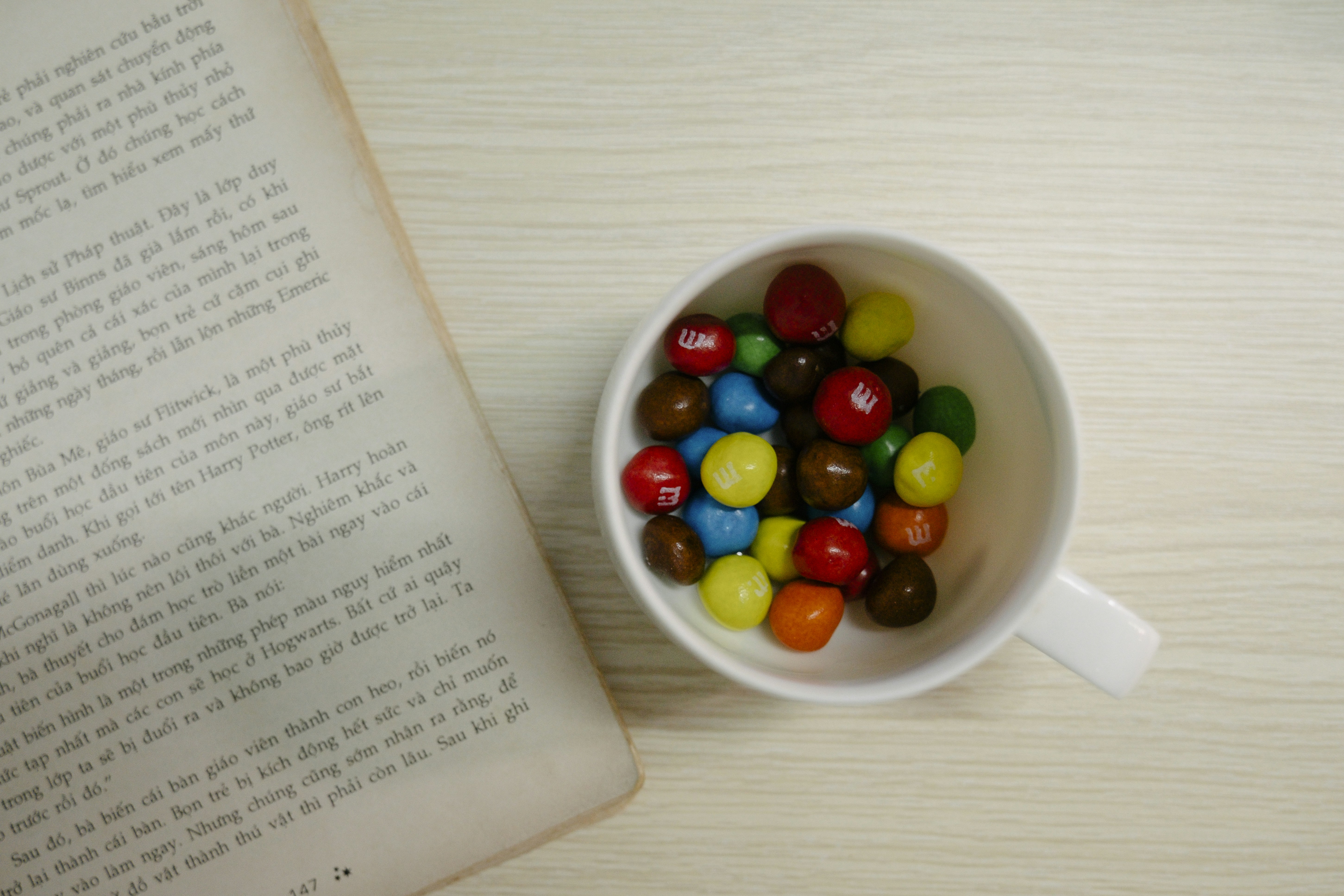 red green and yellow candies on white ceramic bowl