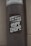 A weathered pole displays a monochromatic sticker with bold, stylized text reading 'The Kulture of Hype & Hope'. The surrounding environment suggests an urban setting with a gritty texture.