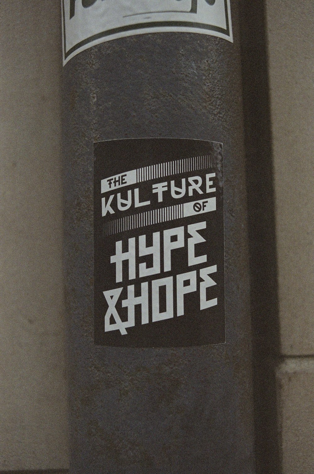 a close up of a sticker on a pole