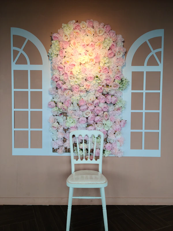 Dusty rose accent chair with walnut shelving