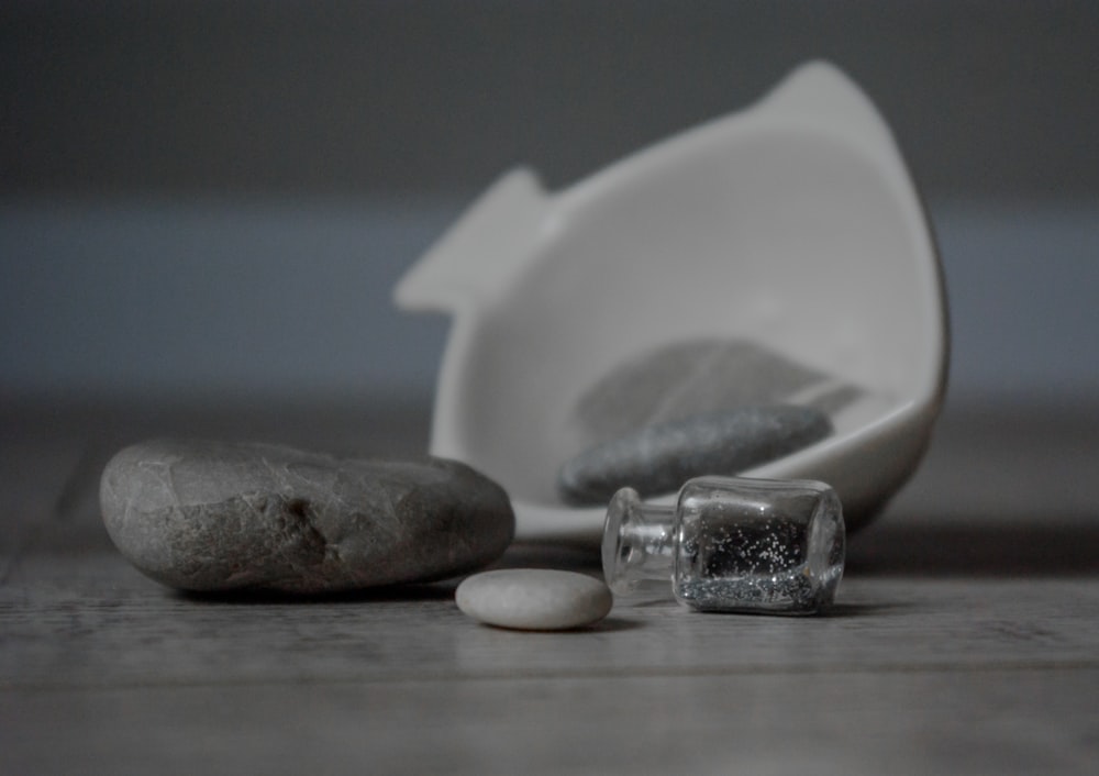 white ceramic heart shaped bowl on brown wooden table