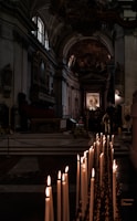 A serene church interior with soft candlelight illuminating the altar.