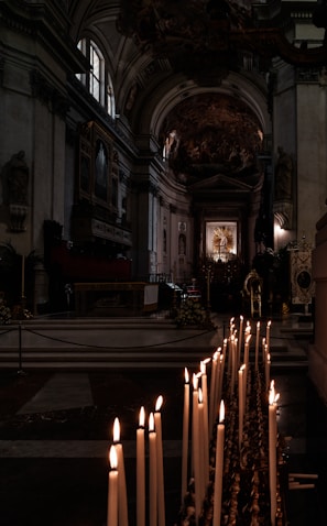 A serene church interior with soft candlelight illuminating the altar.