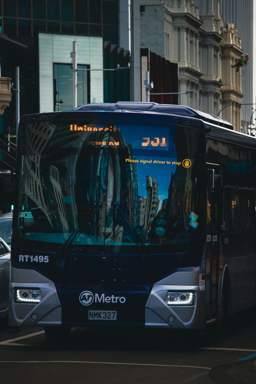 blue and black bus on road during daytime