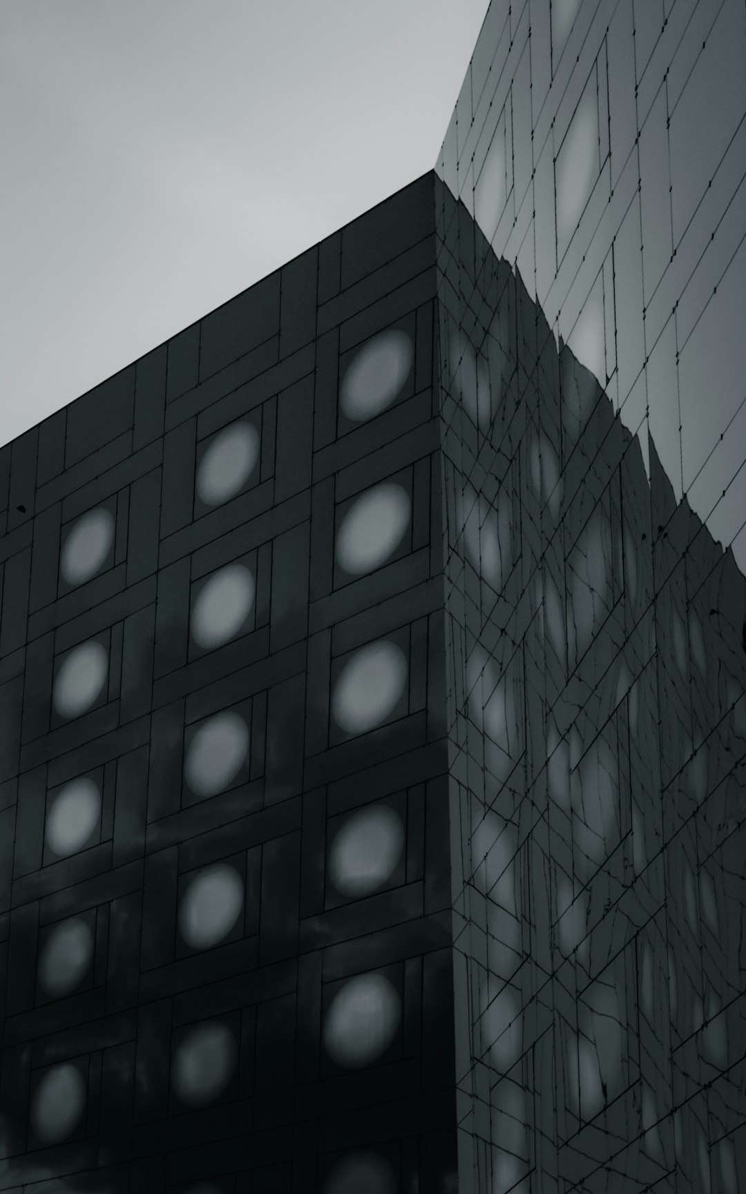 blue glass walled high rise building