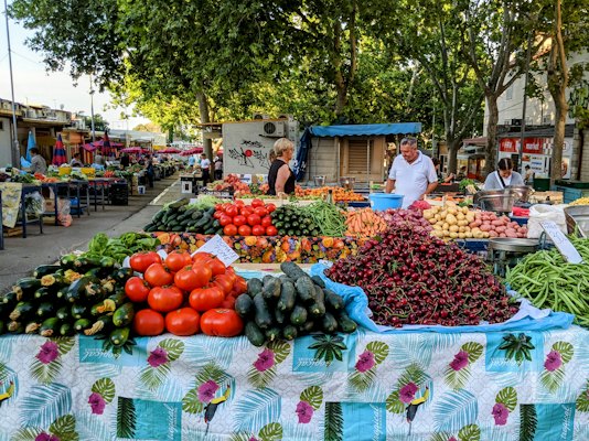 Red and green fruits on blue and white floral table cloth — Split, Croatia