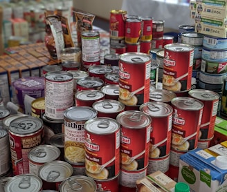 red and white labeled cans