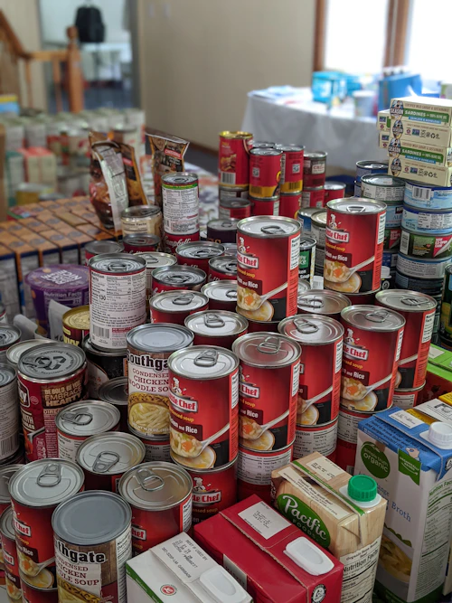 Red and white labeled canned food