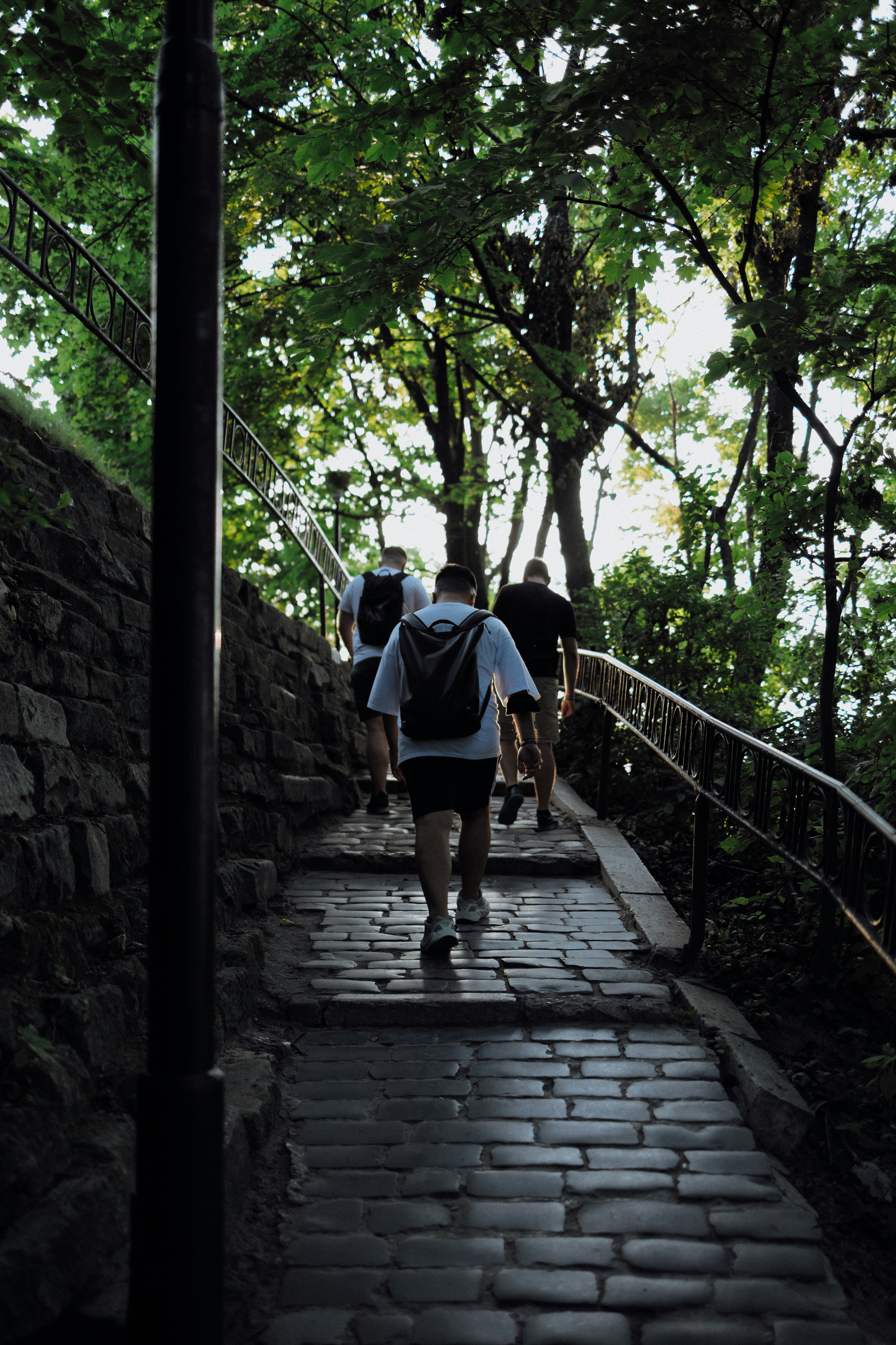 2 men walking on stairs