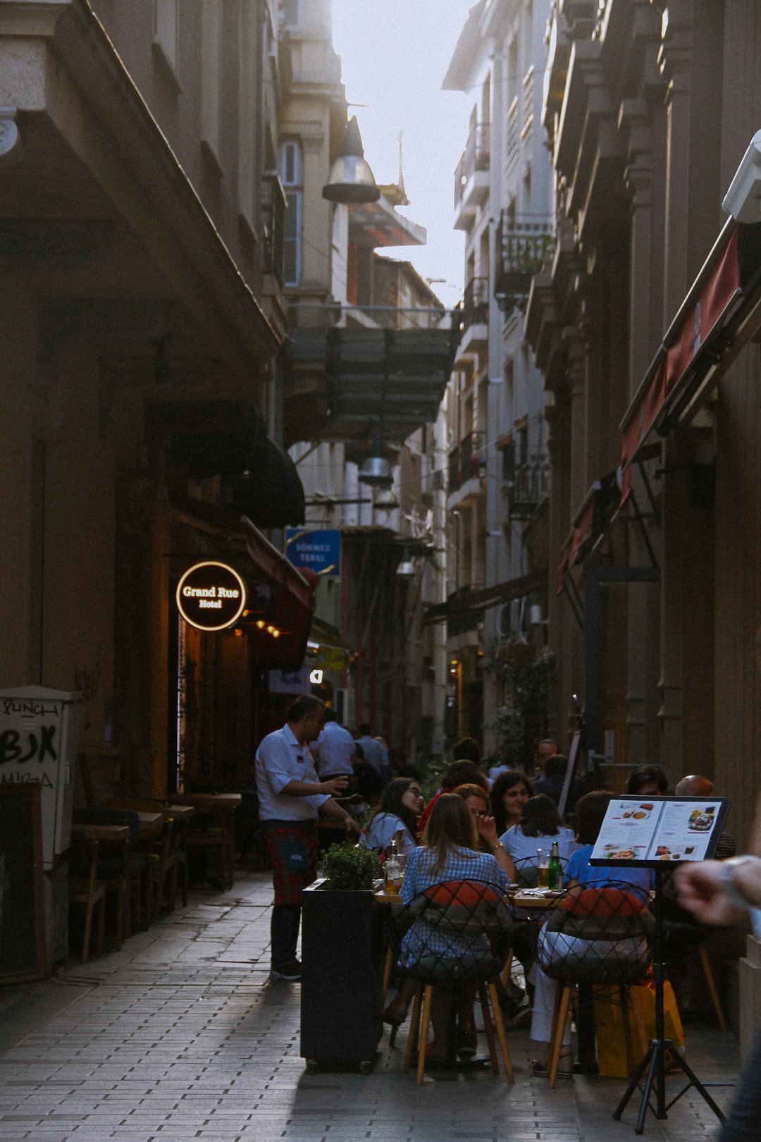 people sitting on chair near building during daytime