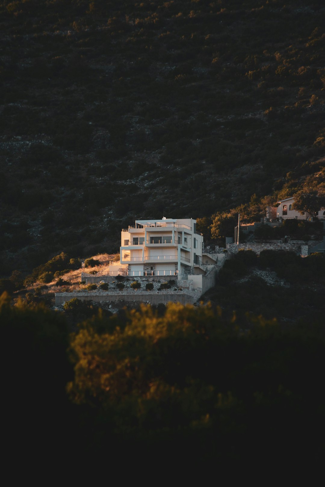 white concrete building on top of mountain during daytime