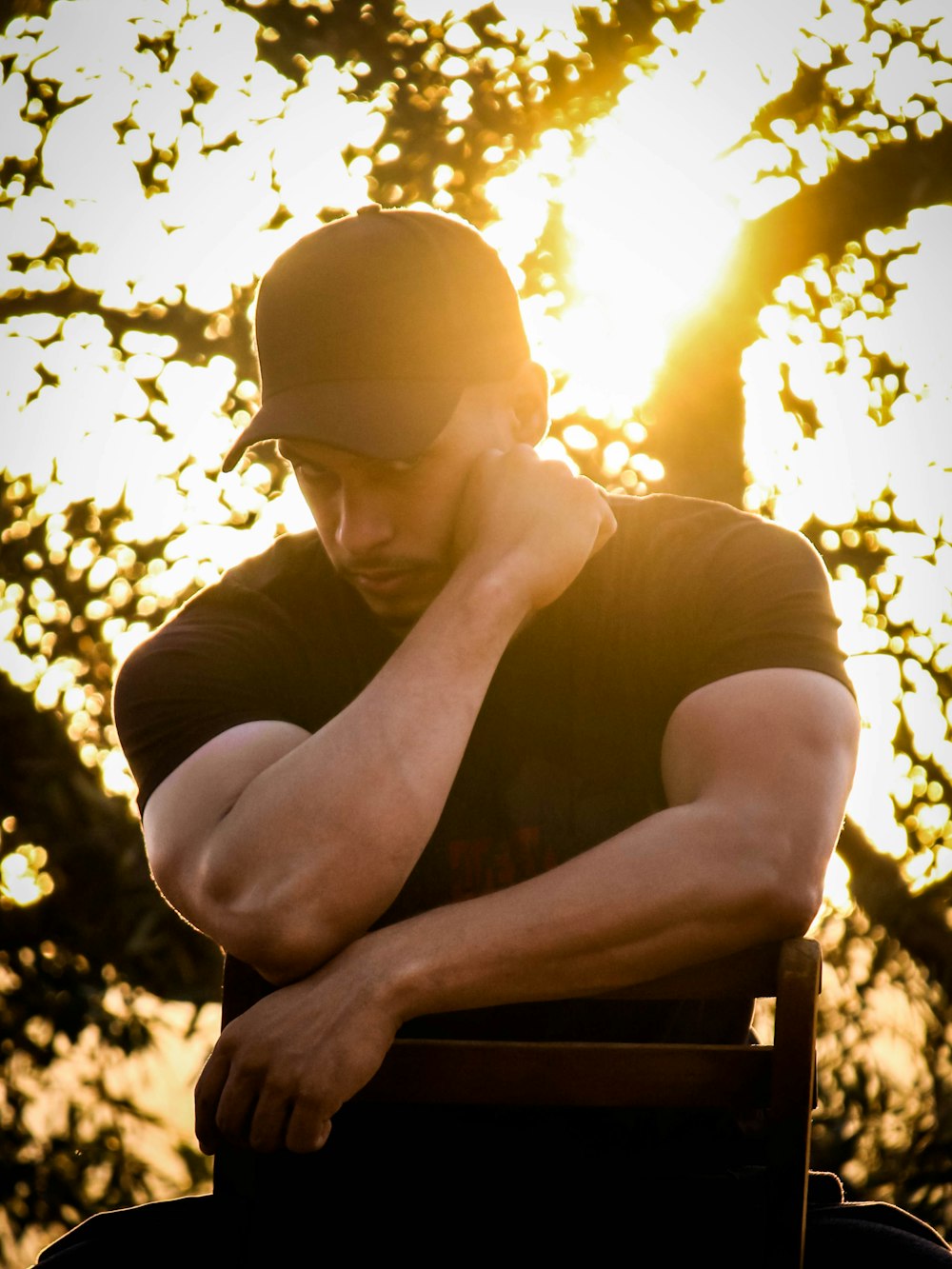 man in black crew neck t-shirt wearing black sunglasses