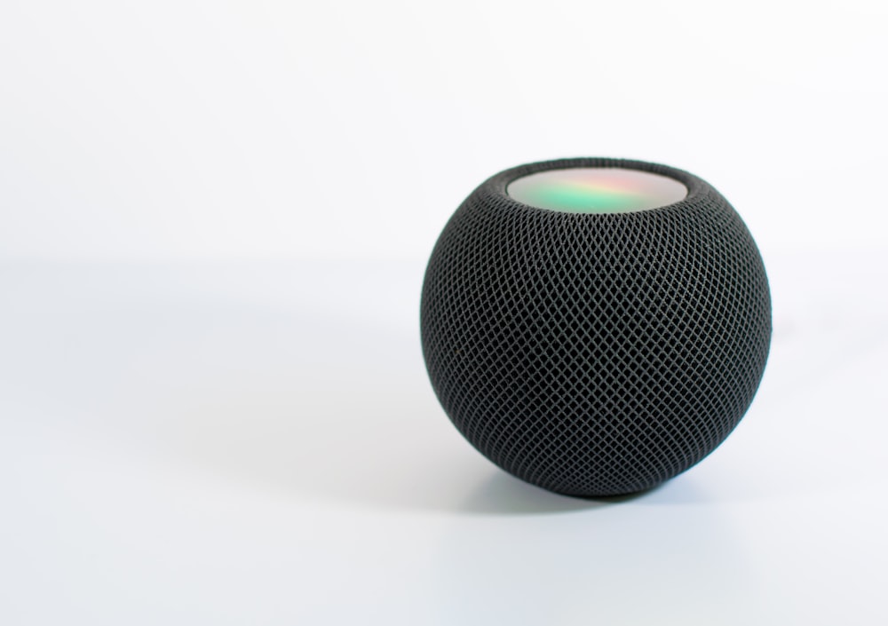 black and white round portable speaker