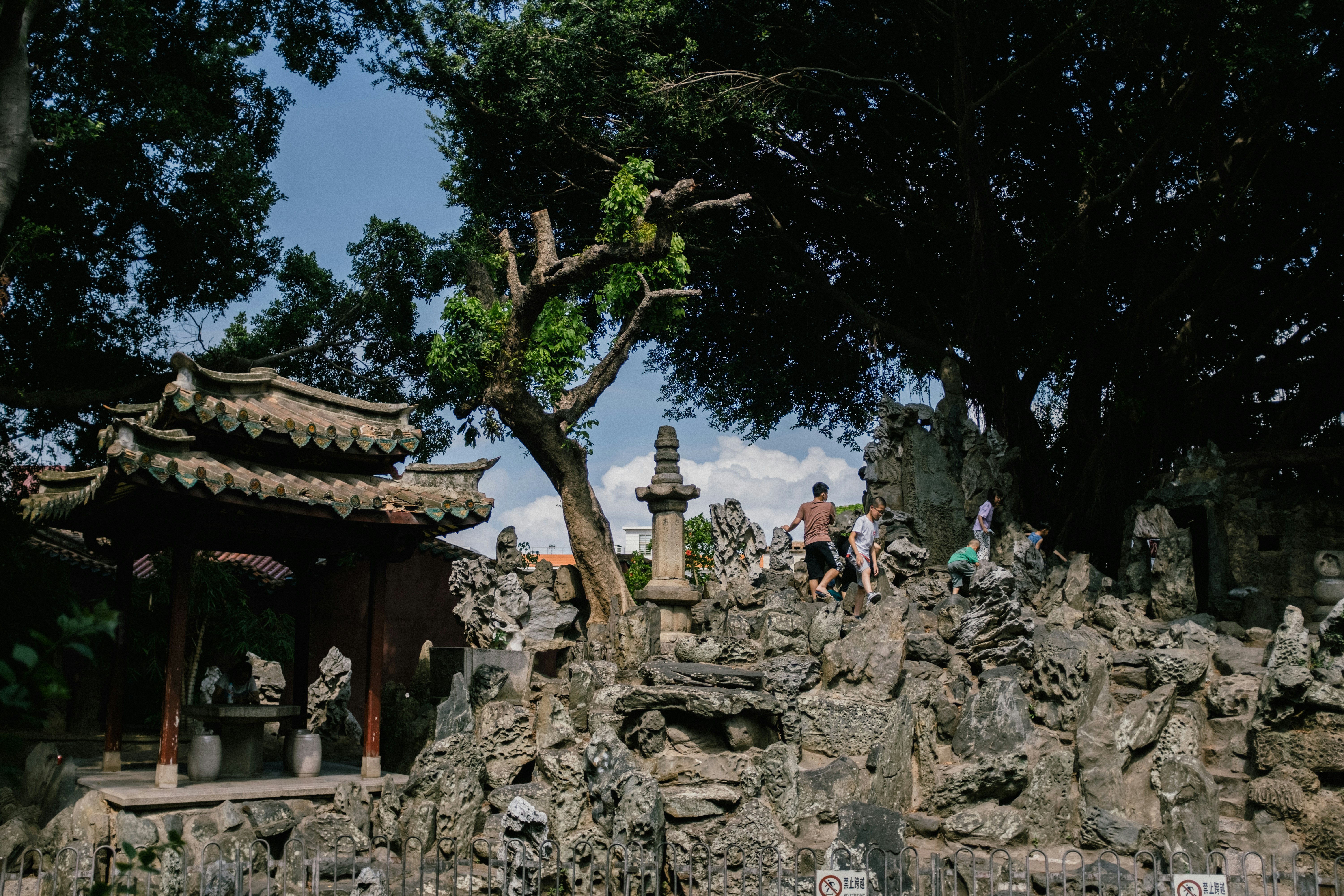 people sitting on gray concrete bench during daytime