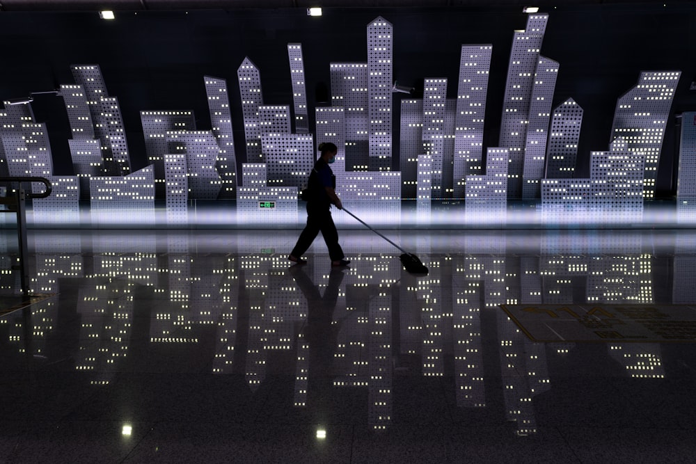 man in black jacket walking on street during night time