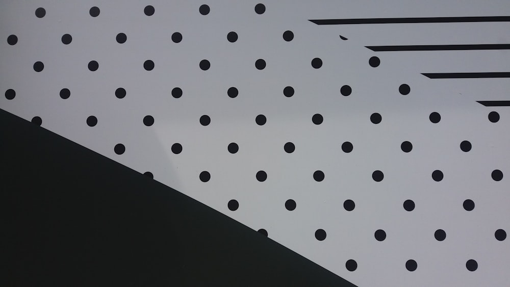 white and black polka dot textile