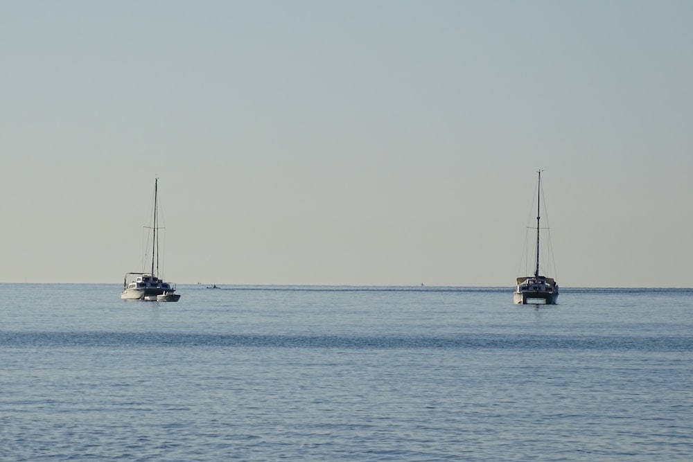 black boat on sea during daytime