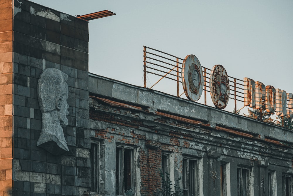 gray concrete building with red and white flag on top