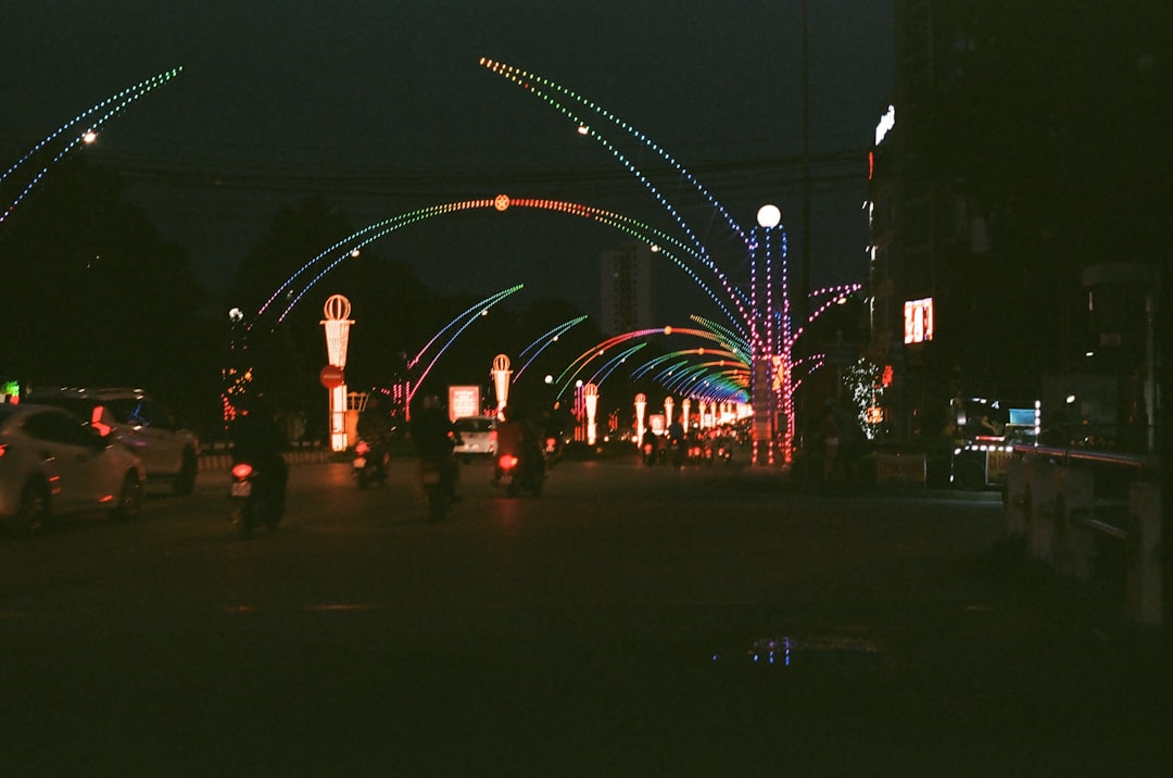 people walking on street with lights during night time
